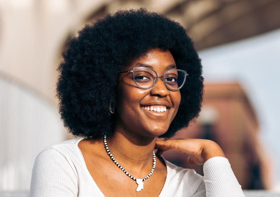 curly hairstyle for black teenage girl with glasses