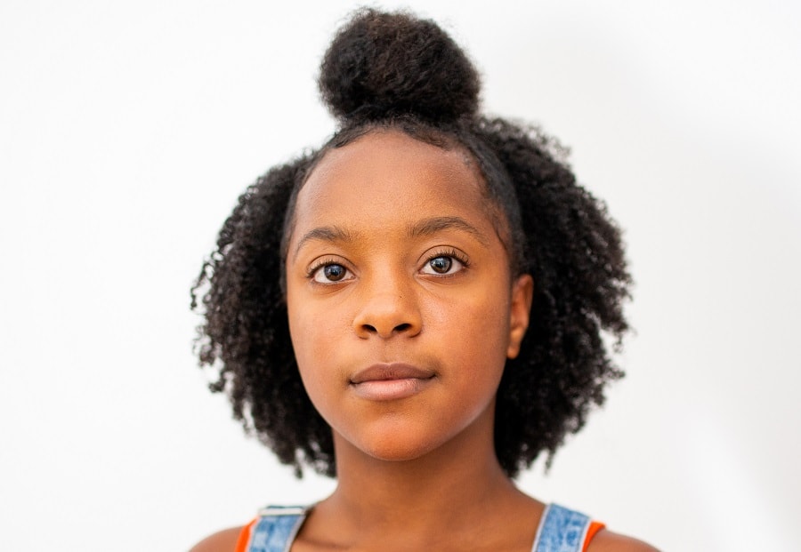 curly half up half down hairstyle for black teenage girl