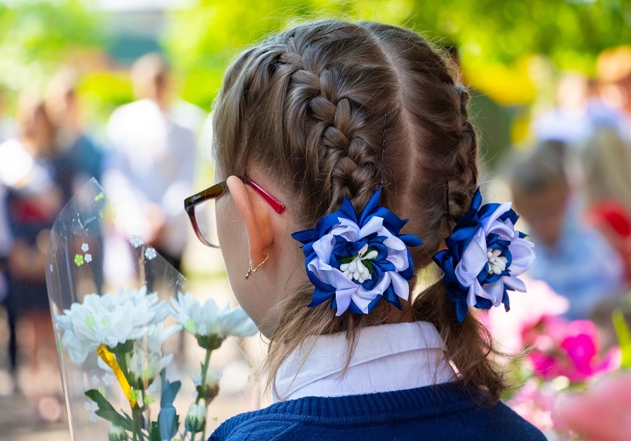 flower girl with braided pigtails