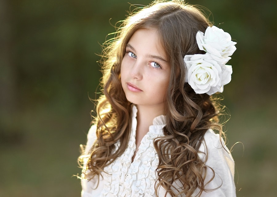 flower girl with curly brown hairstyle