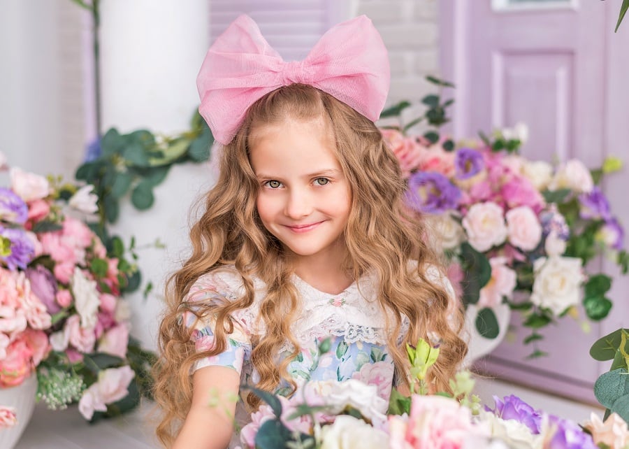 flower girl with long blonde curly hair
