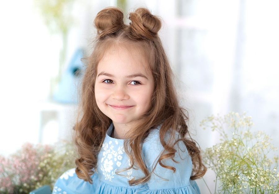 flower girl with space buns hairstyle