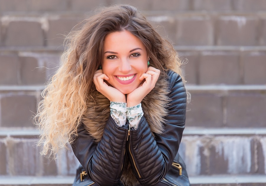 woman with frizzy blonde ombre hair