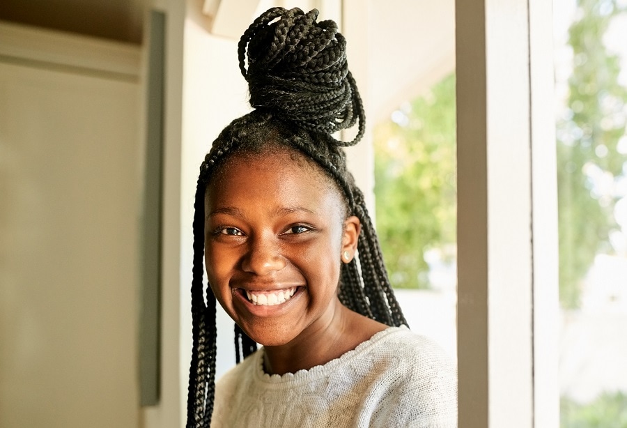 half up half down braided hairstyle for black teenage girl