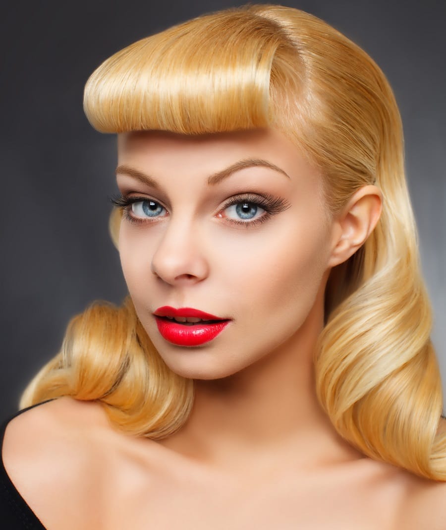 pin up hairstyle for blonde hair with thick bangs