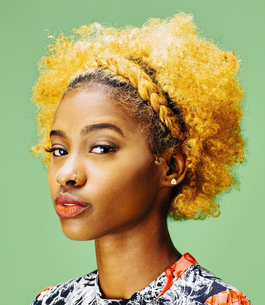 short blonde afro curls with crown braid