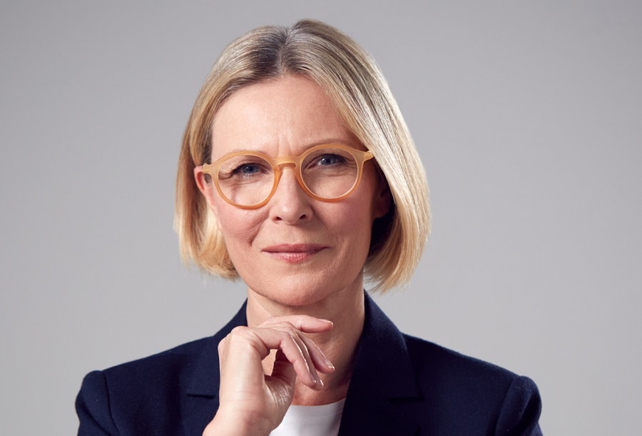 short blonde bob for women over 50 with glasses