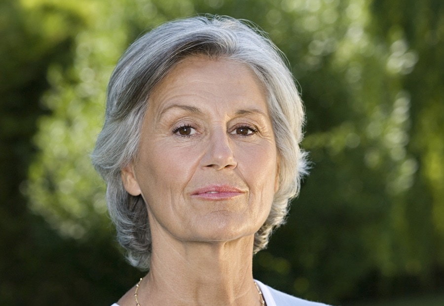 short layered grey hairstyle for women over 60