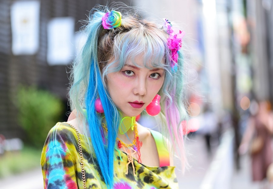 Asian woman with colorful pigtails