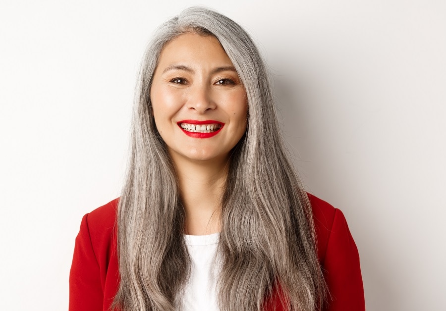 Asian woman with long grey hair