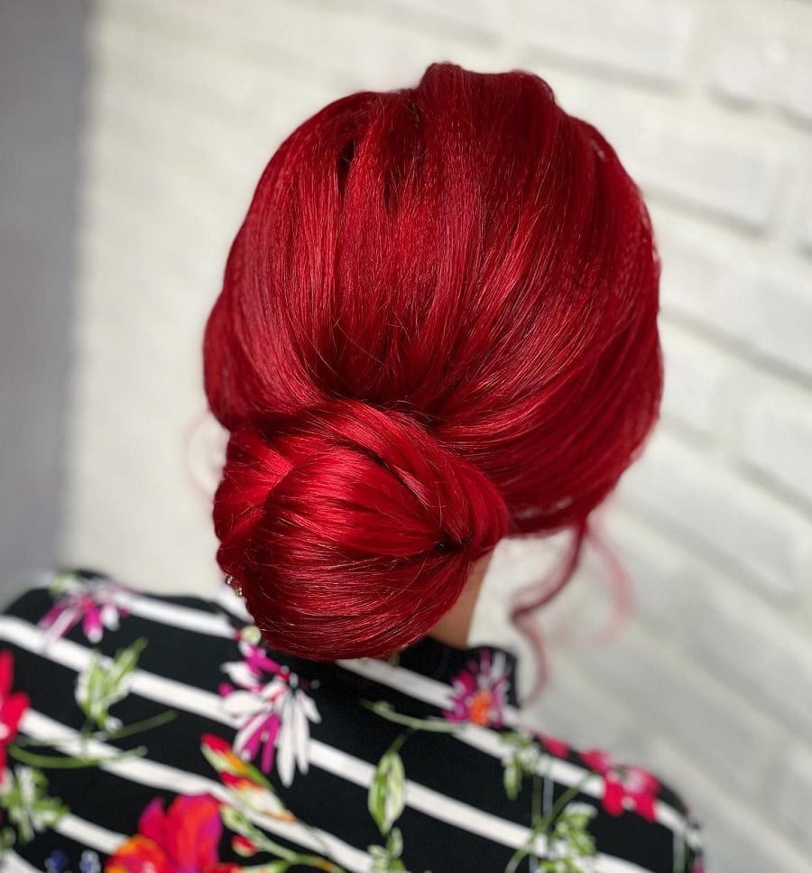 bun hairstyle with bright red hair