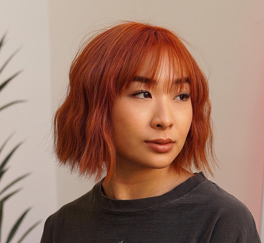 burnt orange hair with bangs