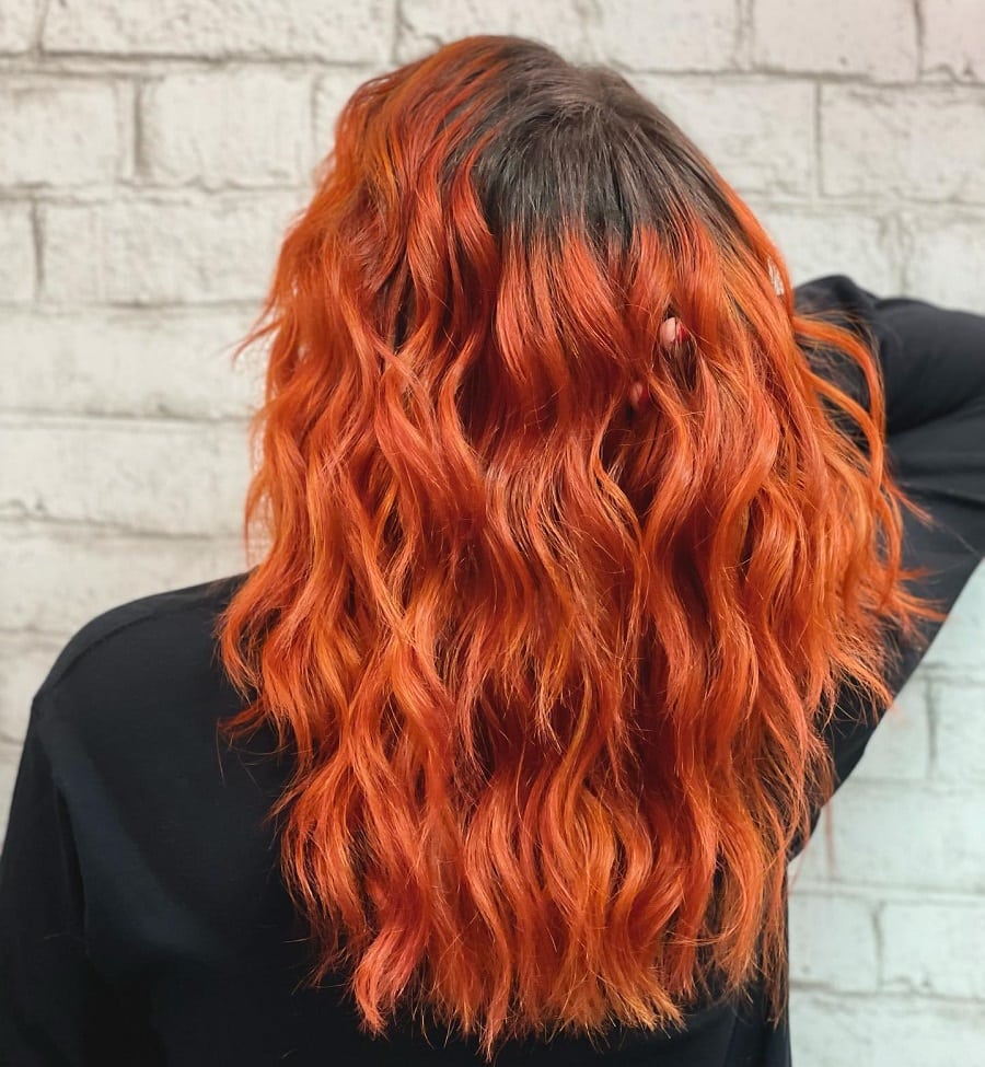 burnt orange hair with dark roots