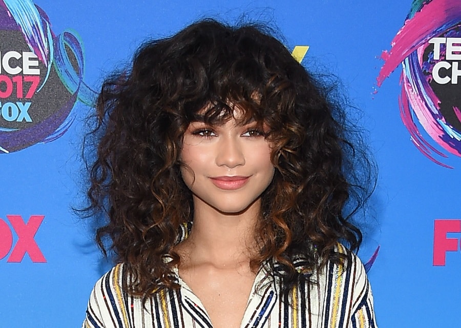 celebrity inspired perm hair with bangs