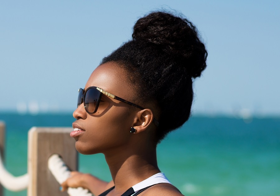 curly black updo hairstyle for beach