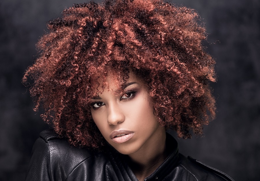 curly hair with pink highlights for dark skin