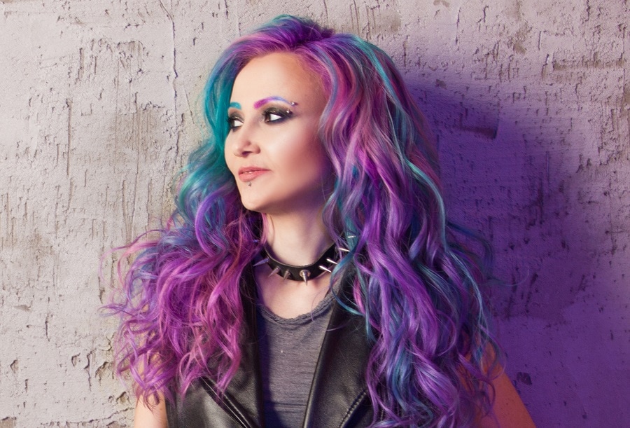 long curly hair with blue and purple highlights