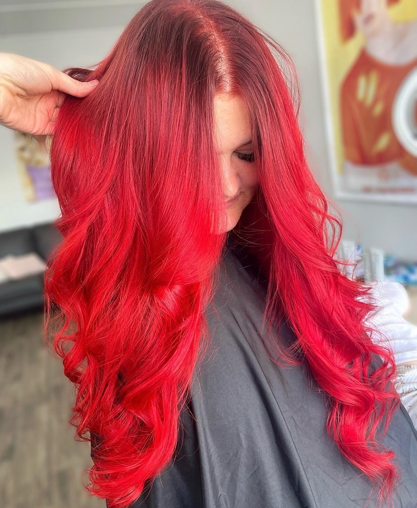 long layered bright red hairstyle
