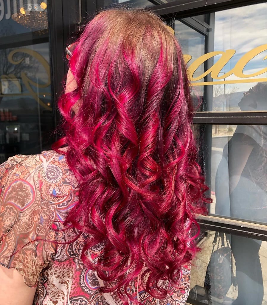 loose curls with magenta red hair