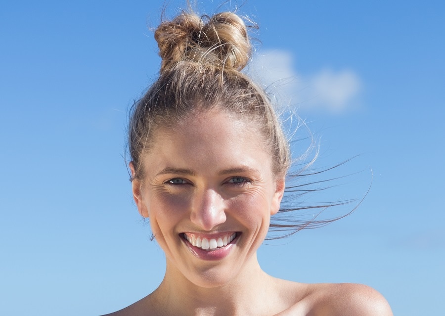 messy high bun hairstyle for beach