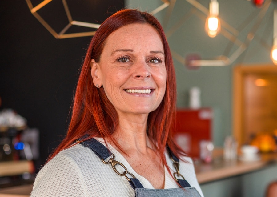 older woman with long red hair