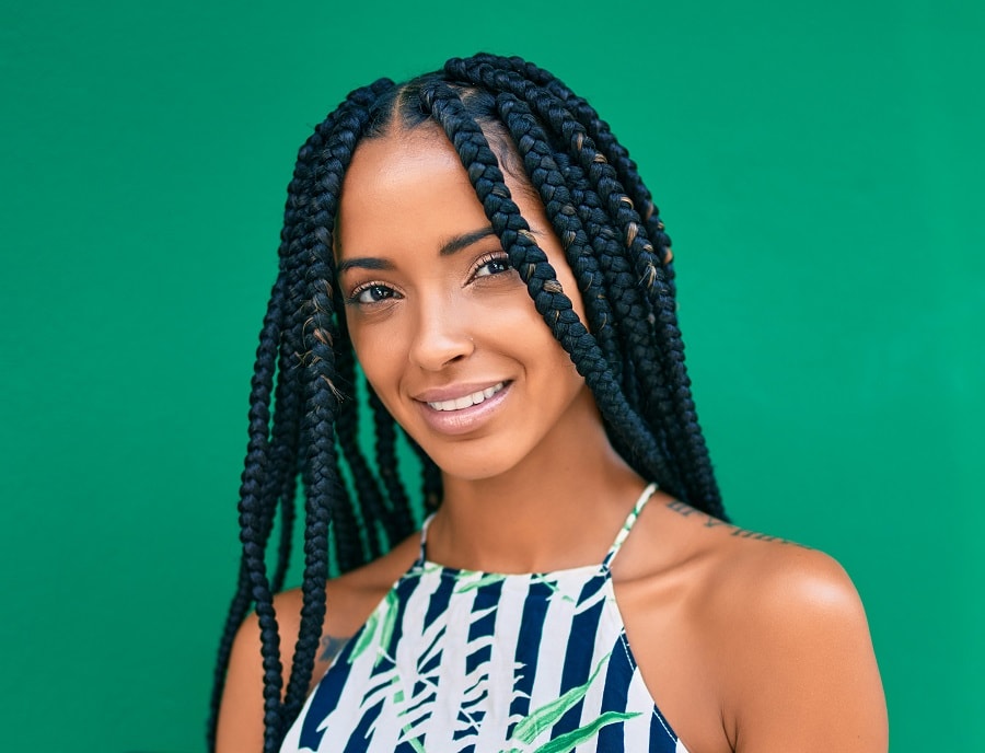 oval face shaped woman with box braids