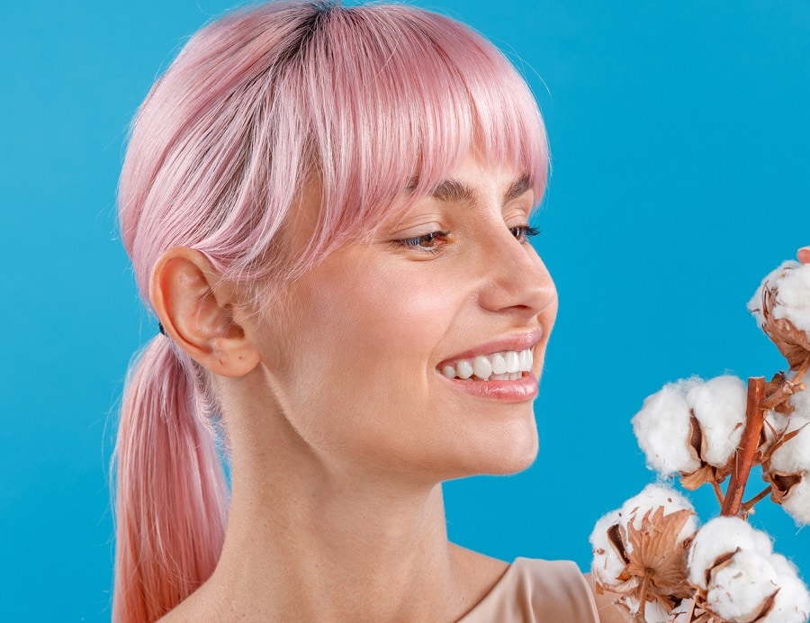 pastel pink ponytail with bangs