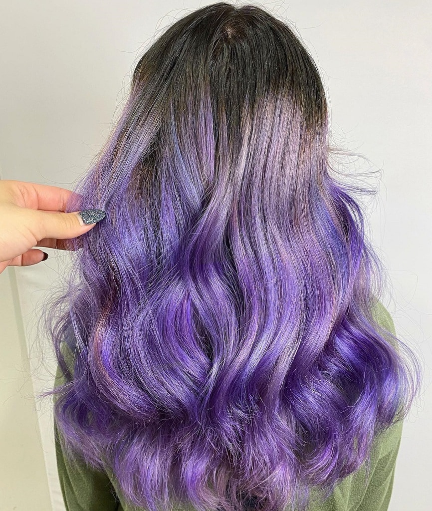 pastel purple balayage hair with dark roots
