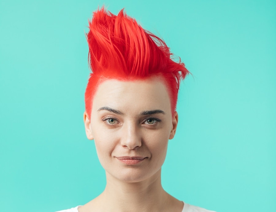 punk hairstyle with short bright red hair