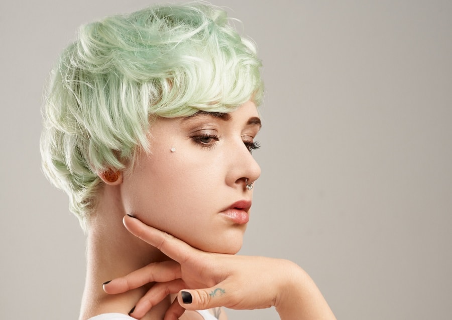 punk hairstyle with short mint green hair