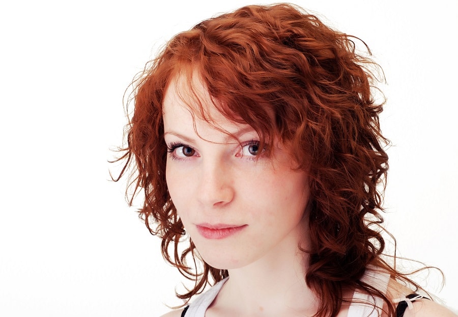 red perm hair with side bangs