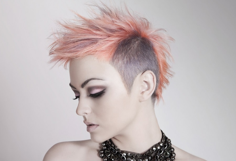 short pastel pink spiky hair with undercut