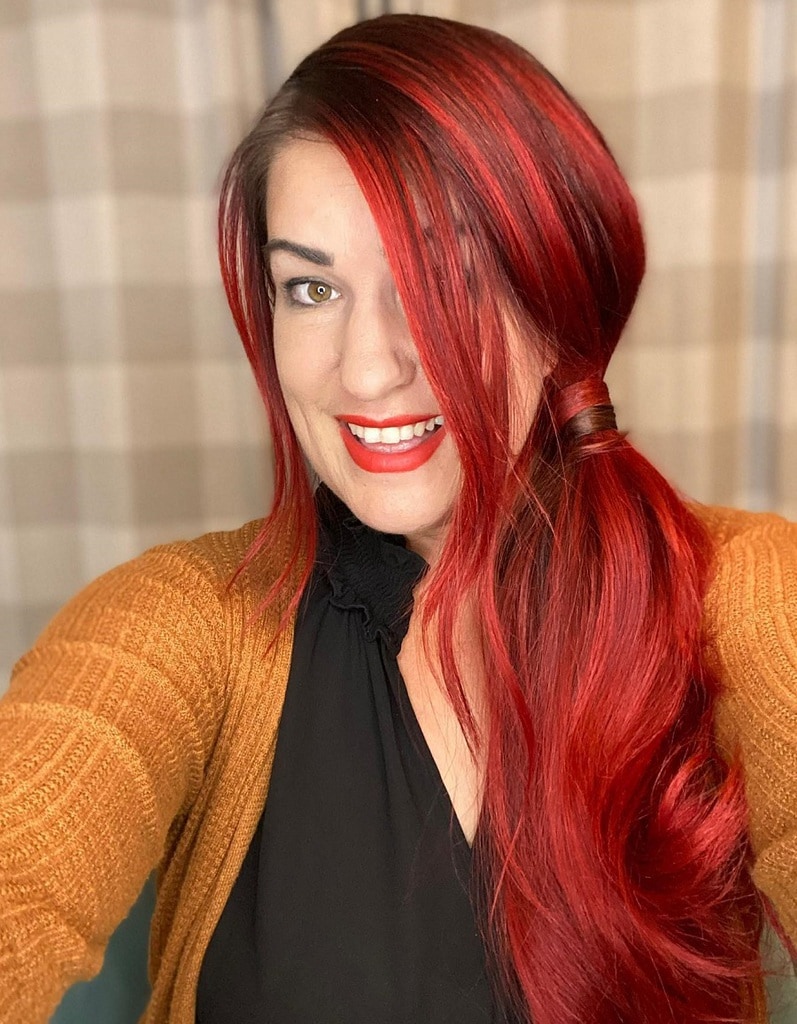 side ponytail with bright red hair
