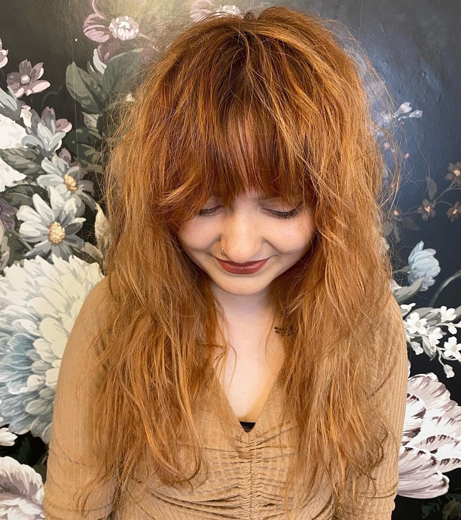 strawberry blonde hairstyle with bangs