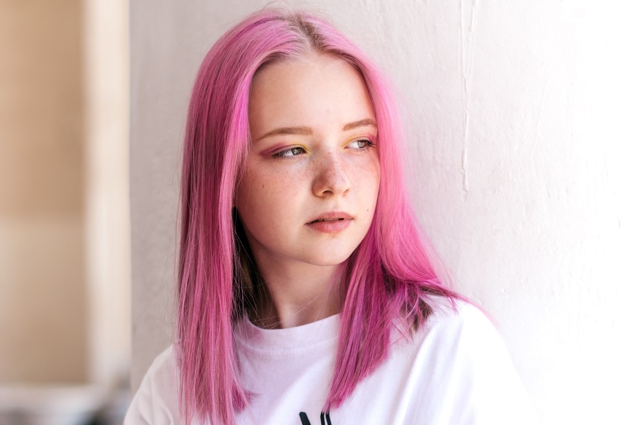 teen girl with pastel pink hair