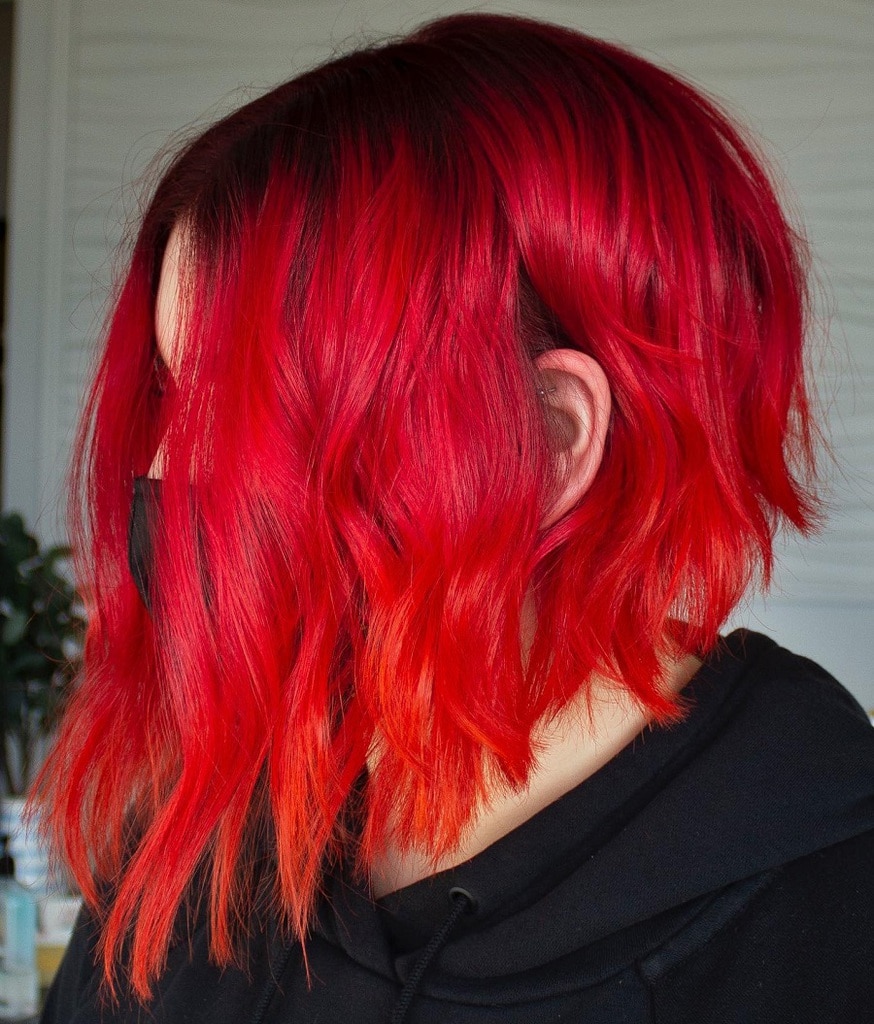 textured lob with bright red hair