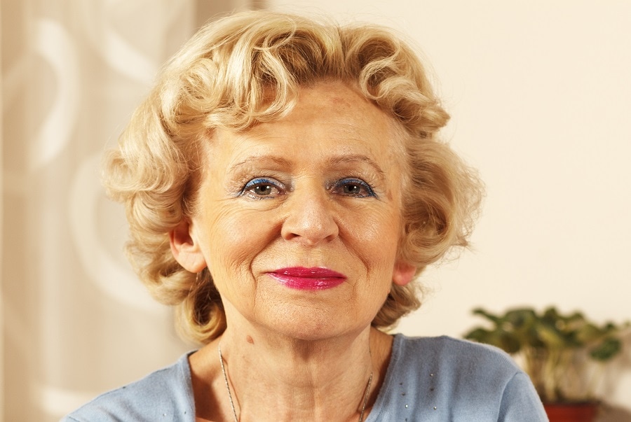 woman over 70 with blonde curls