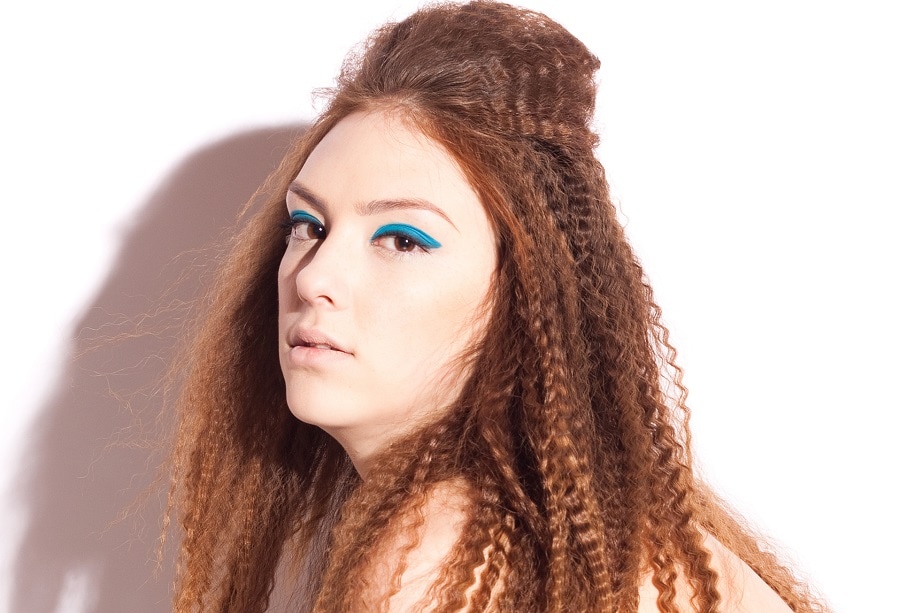 crimped hairstyle with chestnut brown hair