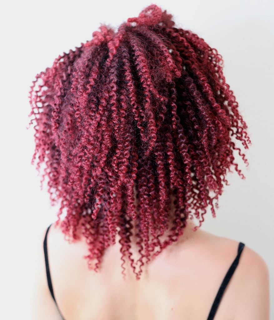 dark magenta red curly hair