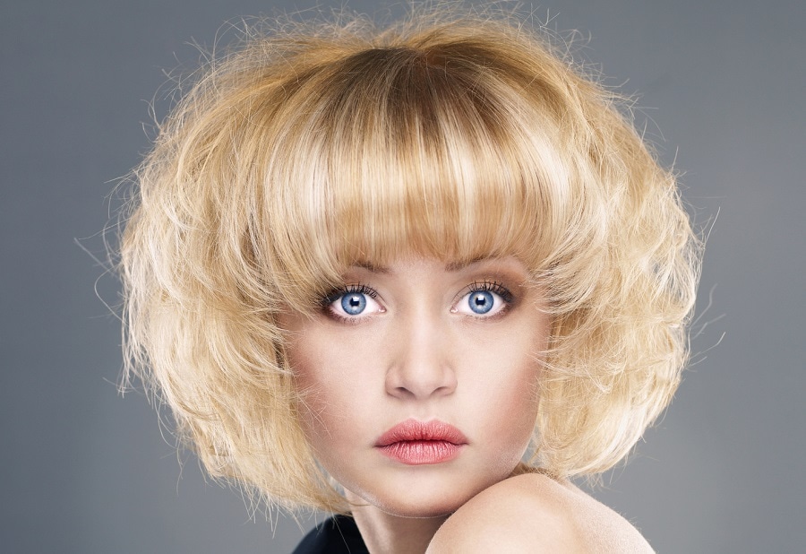 frizzy blonde bob with bangs