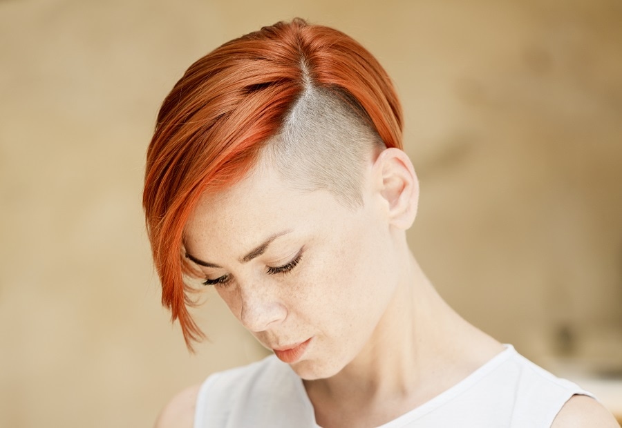 half shaved hairstyle with red hair