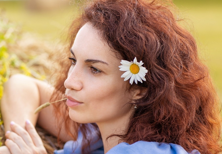 medium auburn hairstyle with frizzy hair