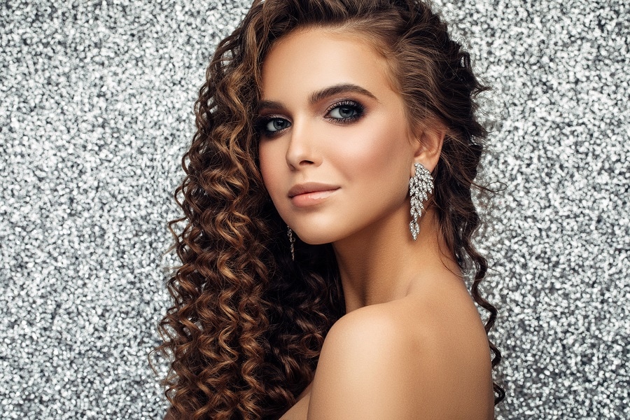 party hairstyle with long curly perm hair