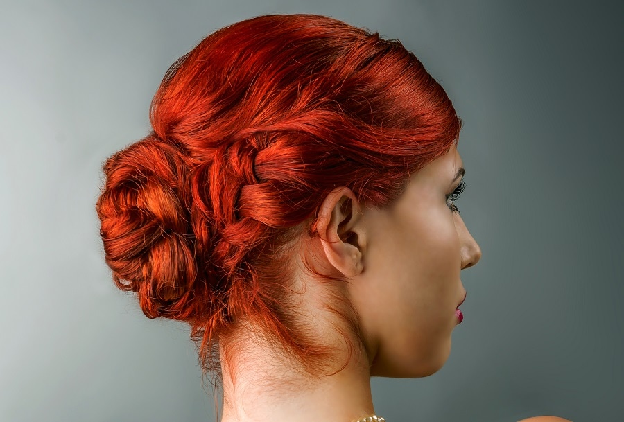 red braided bun hairstyle for prom
