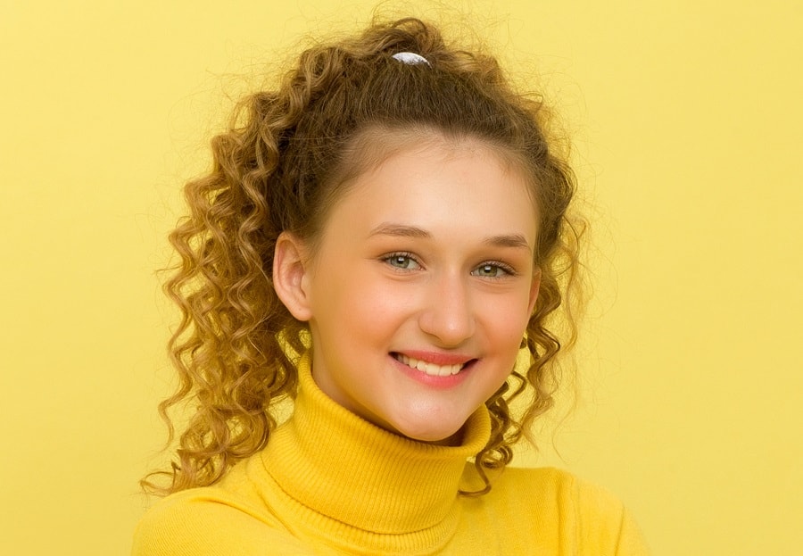 teenage girl with curly ponytail