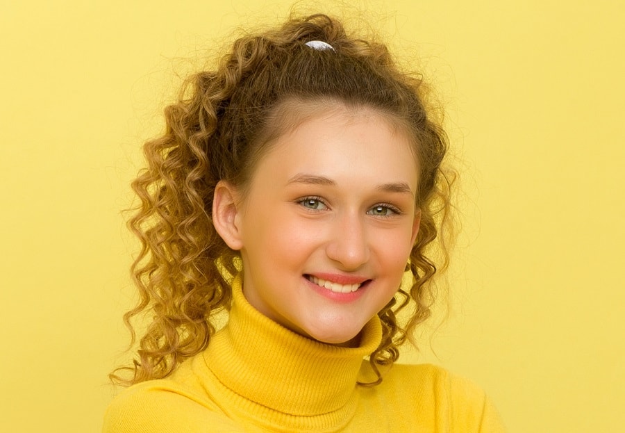 teenage girl with curly ponytail