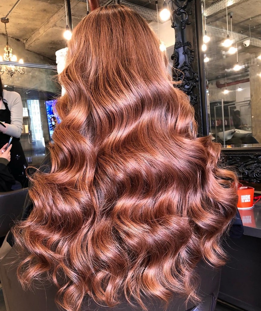 wavy rose gold balayage hair