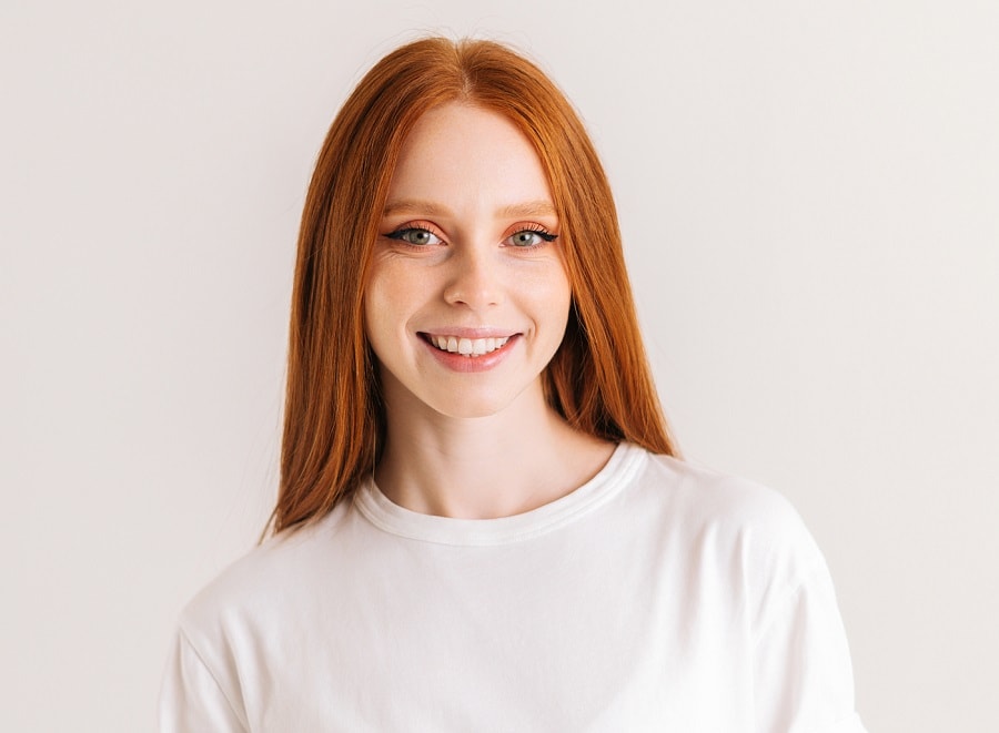 woman with middle part ginger red hair
