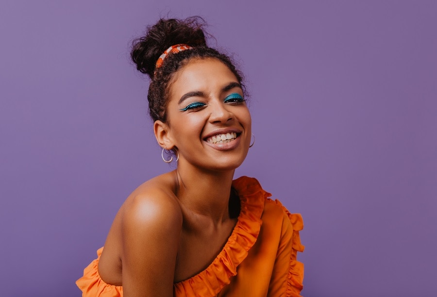 curly updo with asymmetric neckline