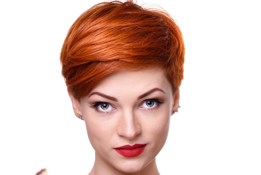 long pixie cut with auburn red hair